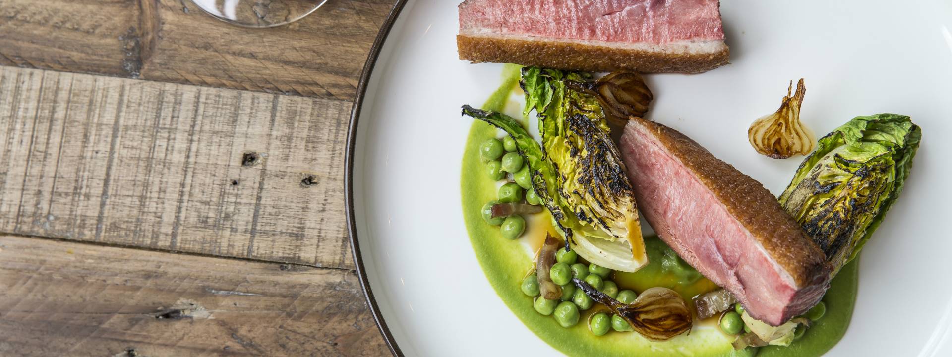 Confit duck pea pureecharred gem lettuce 26